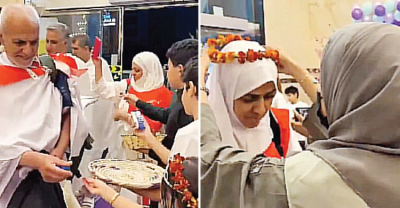 Jamaah Haji Iran terharu mendapatkan kalungan bunga. Foto : Ist